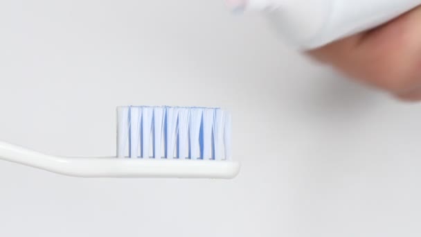 Putting Toothpaste Brush White Background — Stock Video