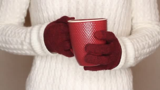 Young Woman White Sweater Holding Red Cup Tea Coffee Changing — Stock Video