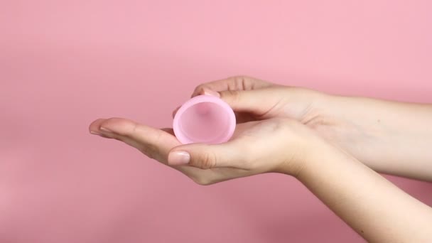 Close Young Woman Hands Holding Reusable Pink Silicone Menstrual Cup — Stock Video