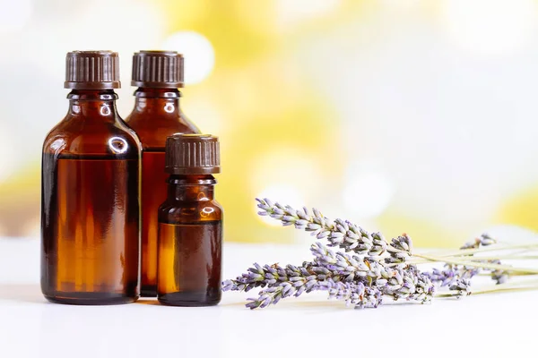 Bottles with organic essential aroma oil with lavender flower — Stock Photo, Image