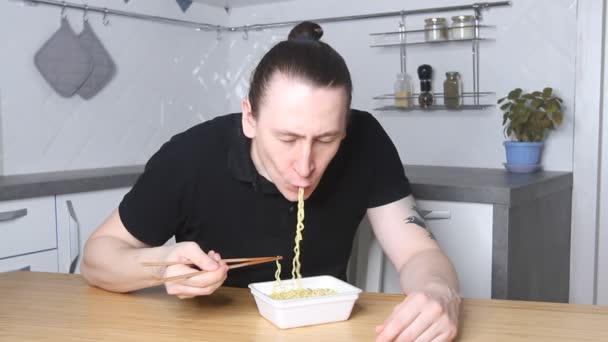 Hungry Adult Man Eats Instant Noodle Chopsticks Home Junk Food — Stock Video