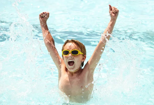 Excited little boy having fun in swimming pool — Stock Photo, Image