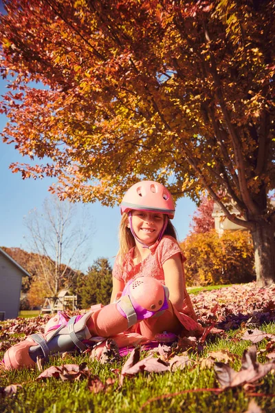 Portrait of happy little girl in roller skates — Stock Photo, Image