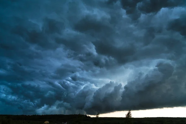 Summer landscape with black storm clouds — Stock Photo, Image