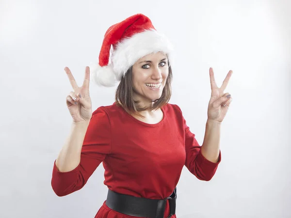 Beautiful woman wearing Santa hat — Stock Photo, Image