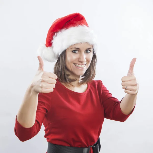 Schöne Frau mit Weihnachtsmütze lizenzfreie Stockbilder