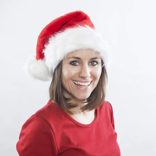Beautiful woman wearing Santa hat — Stock Photo, Image