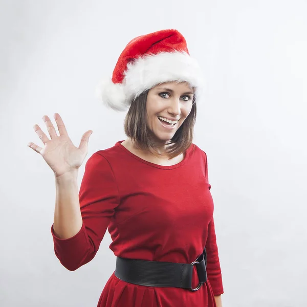 Beautiful woman wearing Santa hat — Stock Photo, Image