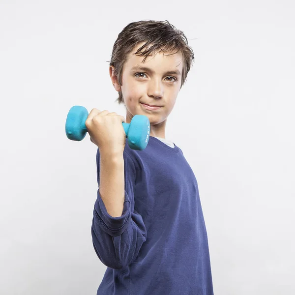 Young boy with dumbbell — Stock Photo, Image