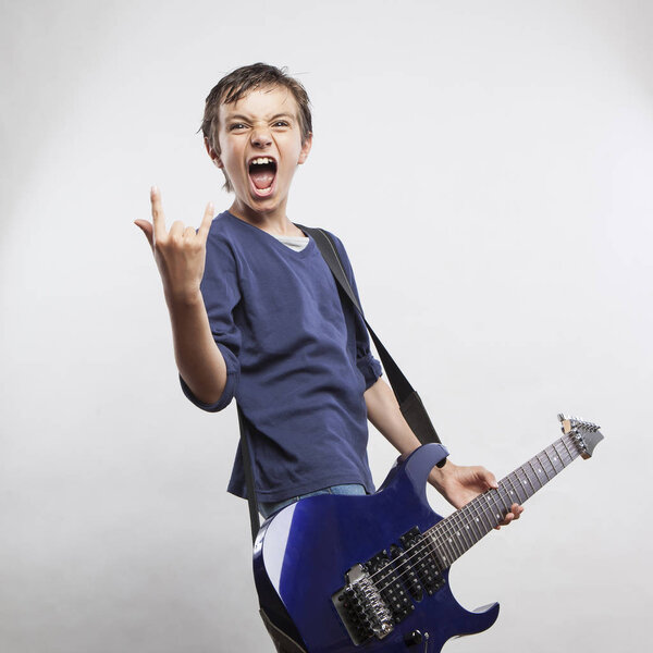 boy playing electric guitar
