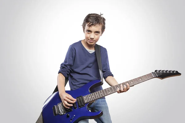 Boy playing electric guitar Stock Photo