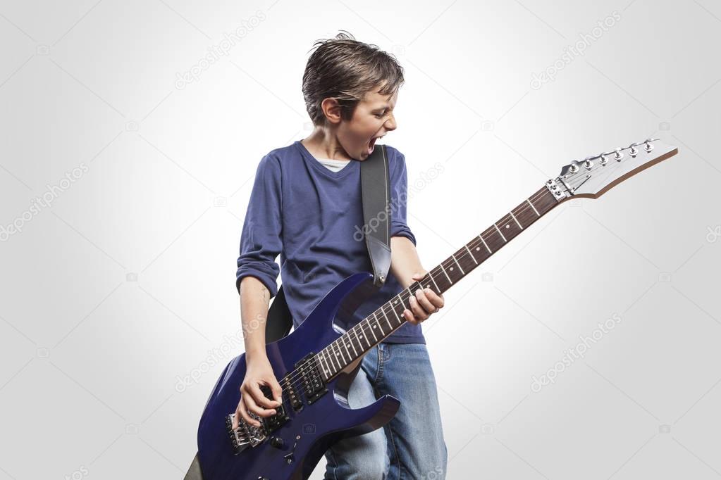 boy playing electric guitar