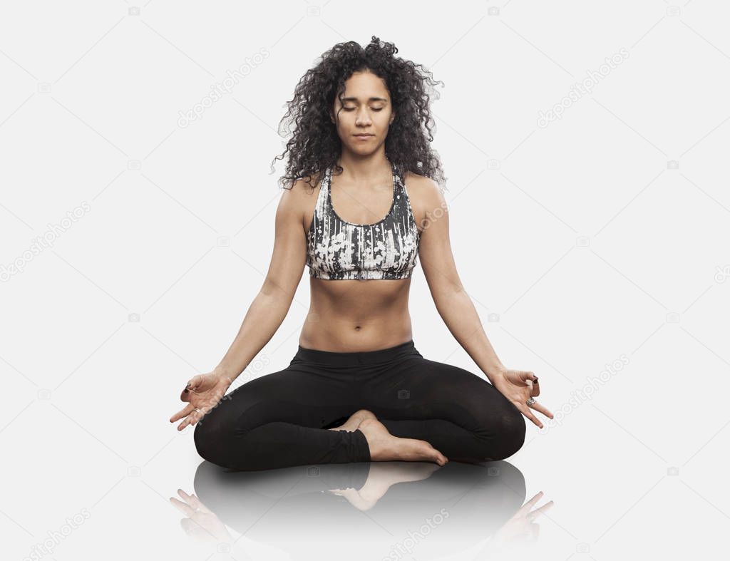 woman meditating in yoga lotus position