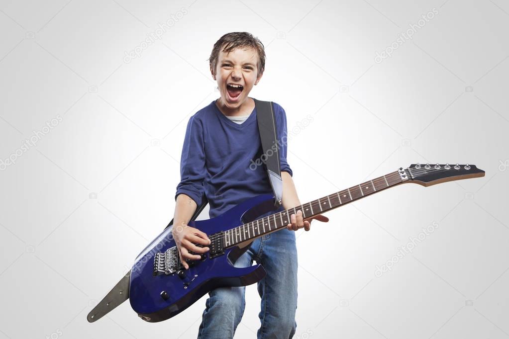 boy playing electric guitar