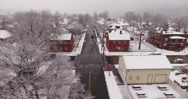 Aerial Snowy Establishing Shot of Small Town Residential Neighborhood — Stock Video