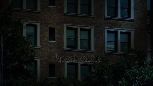 Night Establishing Shot of Office Windows Lights Turning On and Off — Stock Video