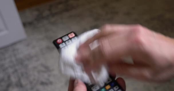 Closeup View Man Cleaning His Television Remote Control Disinfectant Wipe — Stock Video