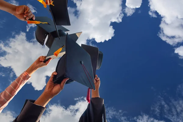 Students Holding Shot Graduation Cap Hand Bright Sky Ceremony Success — Photo