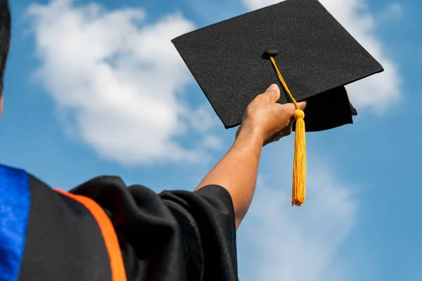 Students Holding Shot Graduation Cap Hand Bright Sky Ceremony Success — Stock Photo, Image