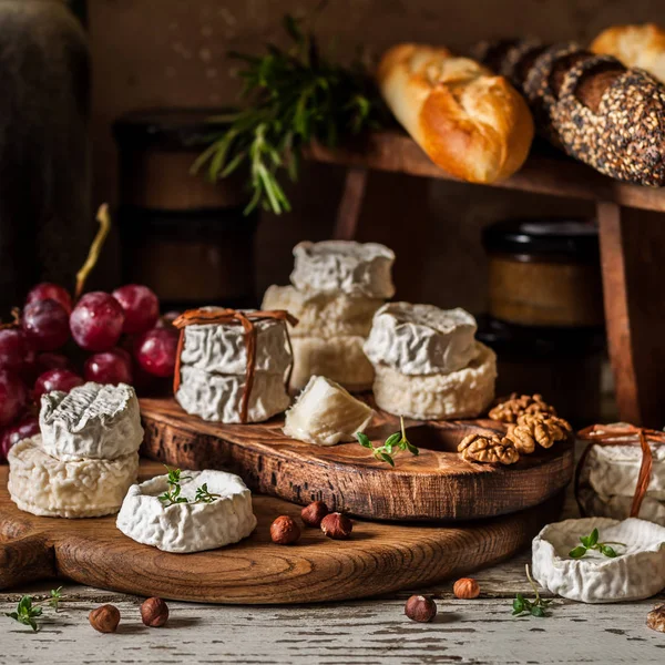 Variety of French Cheeses and Another Provision in a Dusty Pantry, square