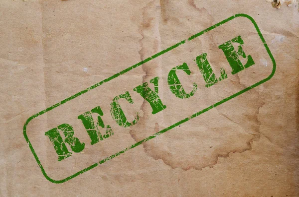 Reciclar carimbo em um pedaço de papelão velho — Fotografia de Stock