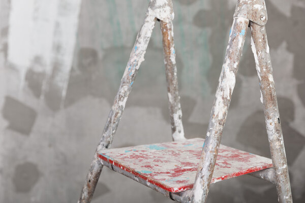 Old painted and stucco ladder concrete wall background