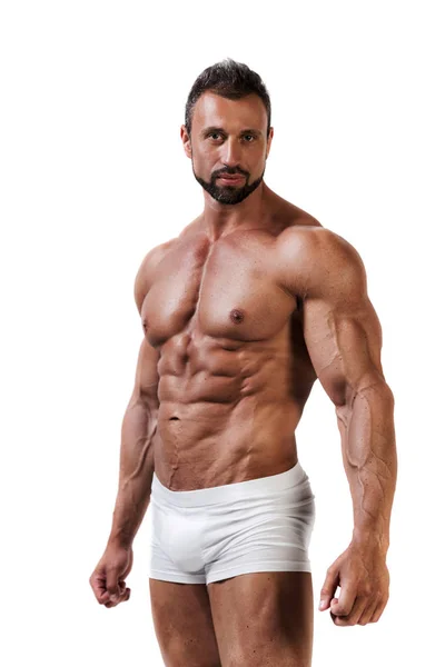 Atletic mięśni człowieka w białej bieliźnie na białym tle — Zdjęcie stockowe