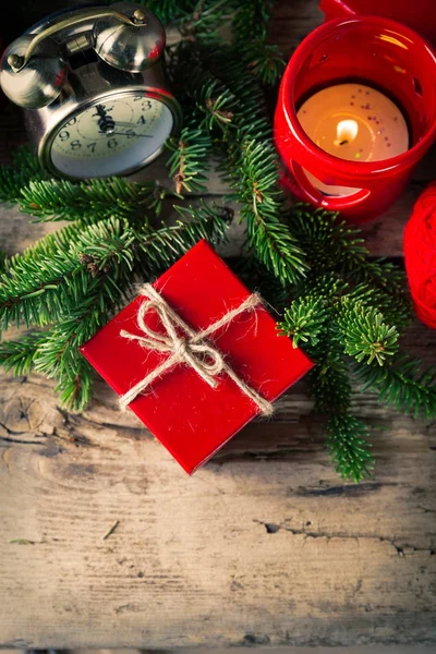 Red present box candle clock Christmas composition — Stock Photo, Image