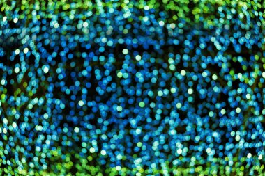 Bokeh bulanıklık yeşil odaklanmamış Noel ışıkları arka plan