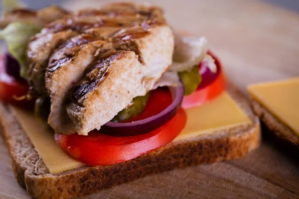 Fresh homemade grilled chicken sandwich on wood — Stock Photo, Image