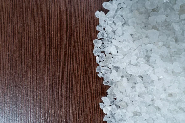 White Crystalline Salt Sprinkled Brown Table — Stock Photo, Image