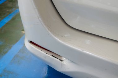 White car rear bumper cracks clipart
