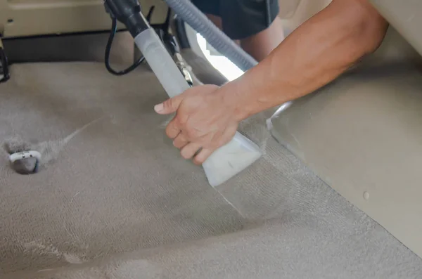 Wash the car carpet.Detailing on interior of modern car.