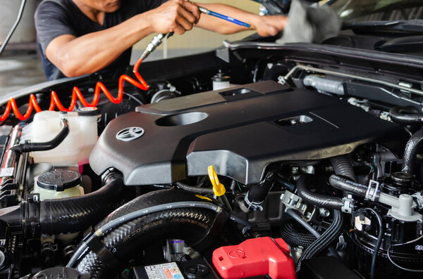 Car details - car engine mechanic, clean after washing the car engine