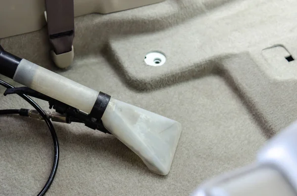 Clean the car carpet with a cleaning machine.Kill germs with chemicals and dirt in the car.