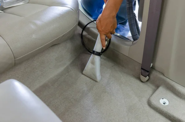 Clean the car carpet with a cleaning machine.Kill germs with chemicals and dirt in the car.Vacuuming inside the car