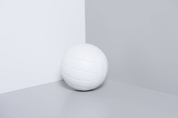 White volleyball ball isolated on white and grey background. 
