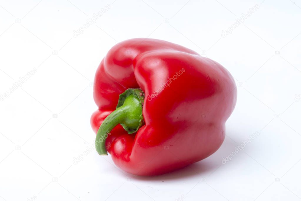 Close-Up Of Red Bell Pepper Against White Background