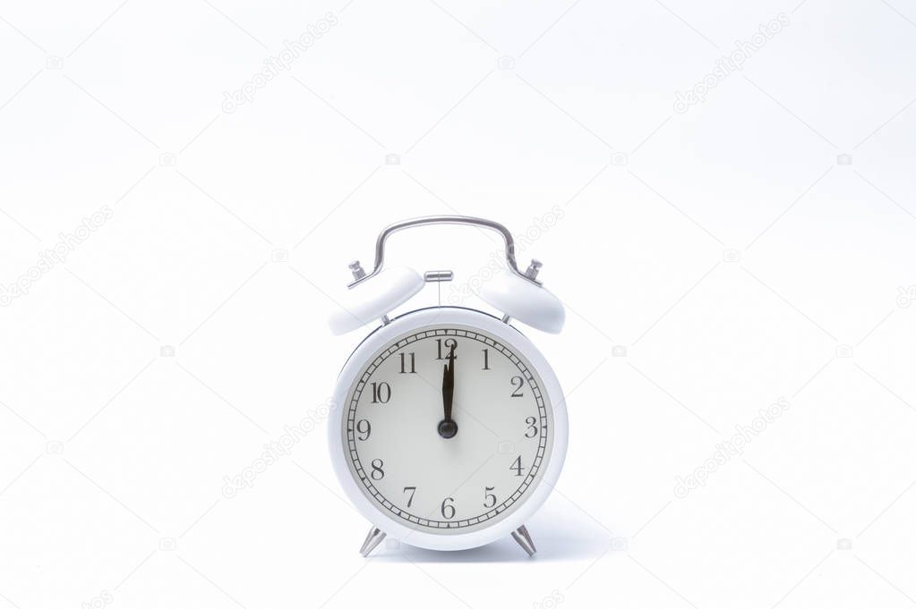 Retro alarm clock or vintage alarm clock isolated on white background