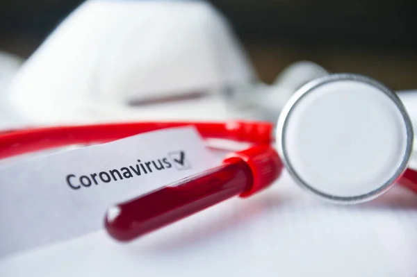 2019-nCoV and Coronavirus blood test in Laboratory Coronavirus test list medical form, mask,test blood tubes stethoscope on documents