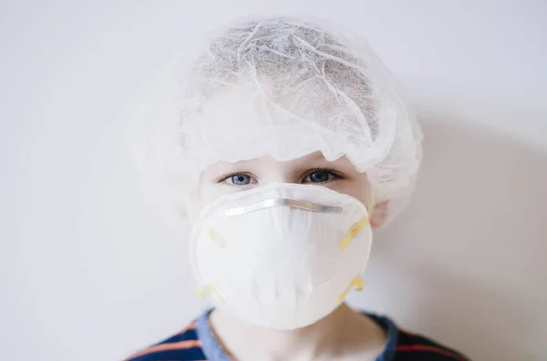 Coronavirus epidemic. Boy with protection mask. Kid in school. Learning, homework, homeschooling, quarantine at home