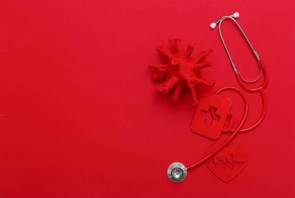 Abstract Virus Strain Model, Heart And Stethoscope On red Background. Corona virus quarantine. Virus Pandemic Protection Concept