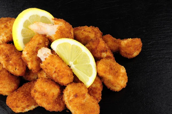 Breadcrumb Covered Fried Scampi On Slate Background — Stock Photo, Image