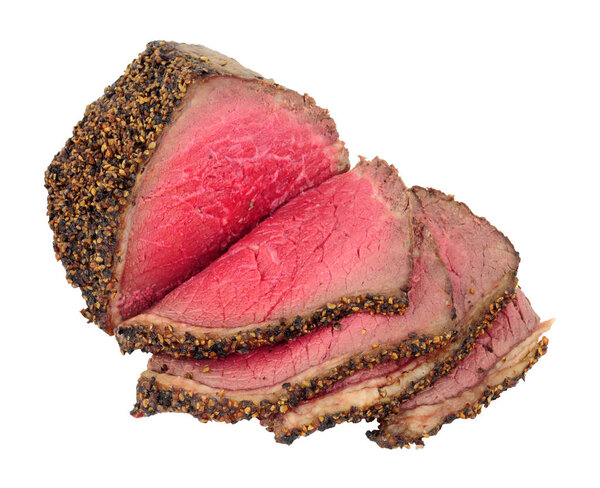 Rare cooked roasted pepper and salt covered beef rump joint also known as a picanha cut and sirloin cap meat cut isolated on a white background