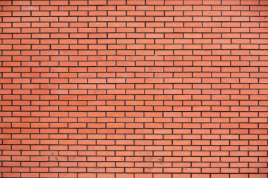 Bir arka plan kırmızı tuğla duvar.