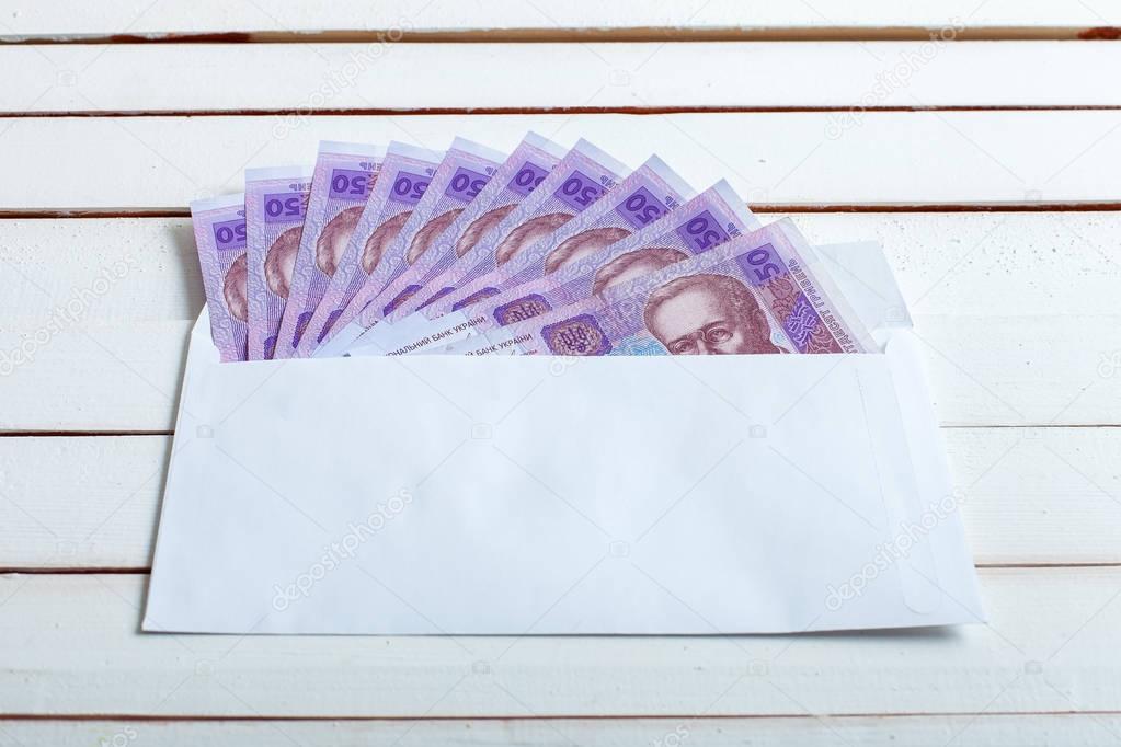 Cash in an envelope ukrainian hryvnia.