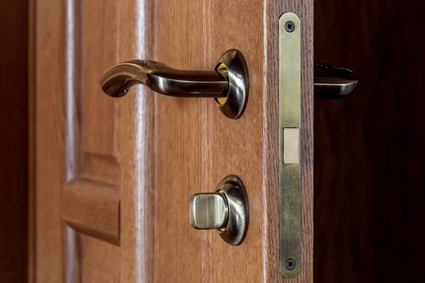 door with the handle and the lock.