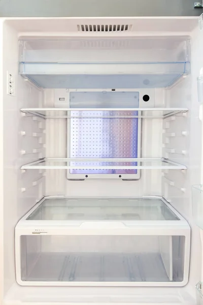 Refrigerator with empty shelves.