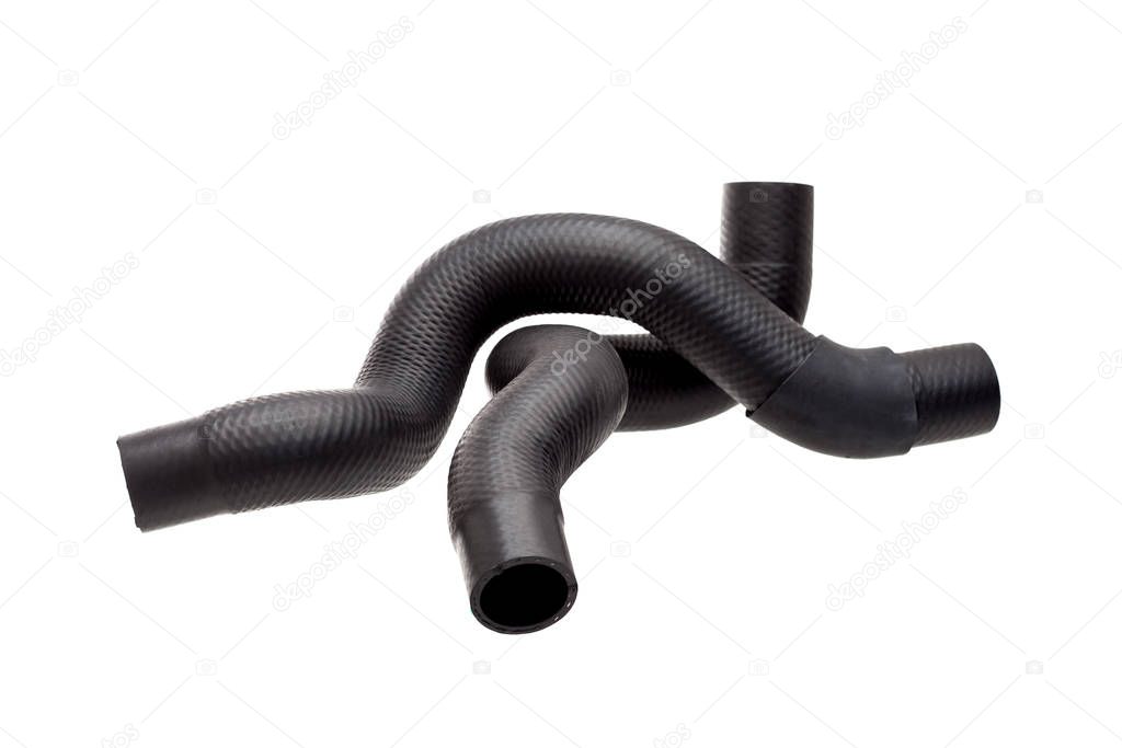 genuine reinforced radiator pipes made of black hard rubber with stiffeners inside, new car spare parts isolated on white background.