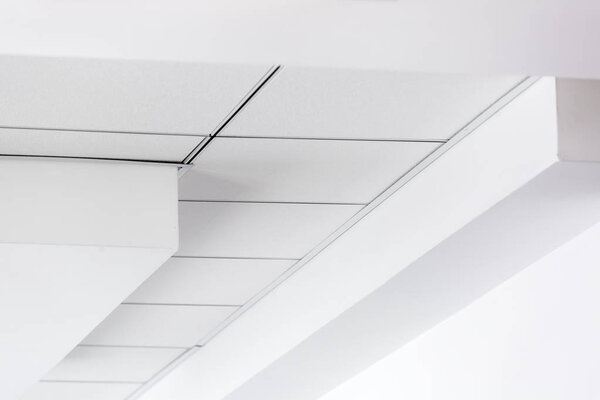 multi-level ceiling with three-dimensional protrusions and a suspended tiled ceiling, perspective on the ceiling.